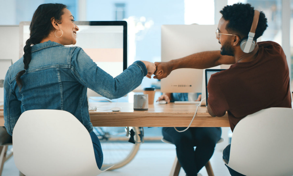 Team meeting representing pathways to work legally in Canada under various programs