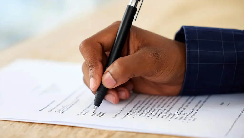 Business the act of signing official documents related to Canadian work permit exemptions and LMIA