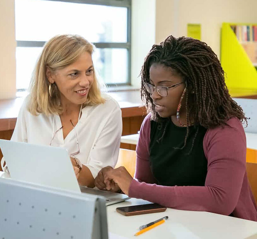 Immigration consultant reviewing Express Entry profile with client to maximize CRS score and enter the pool